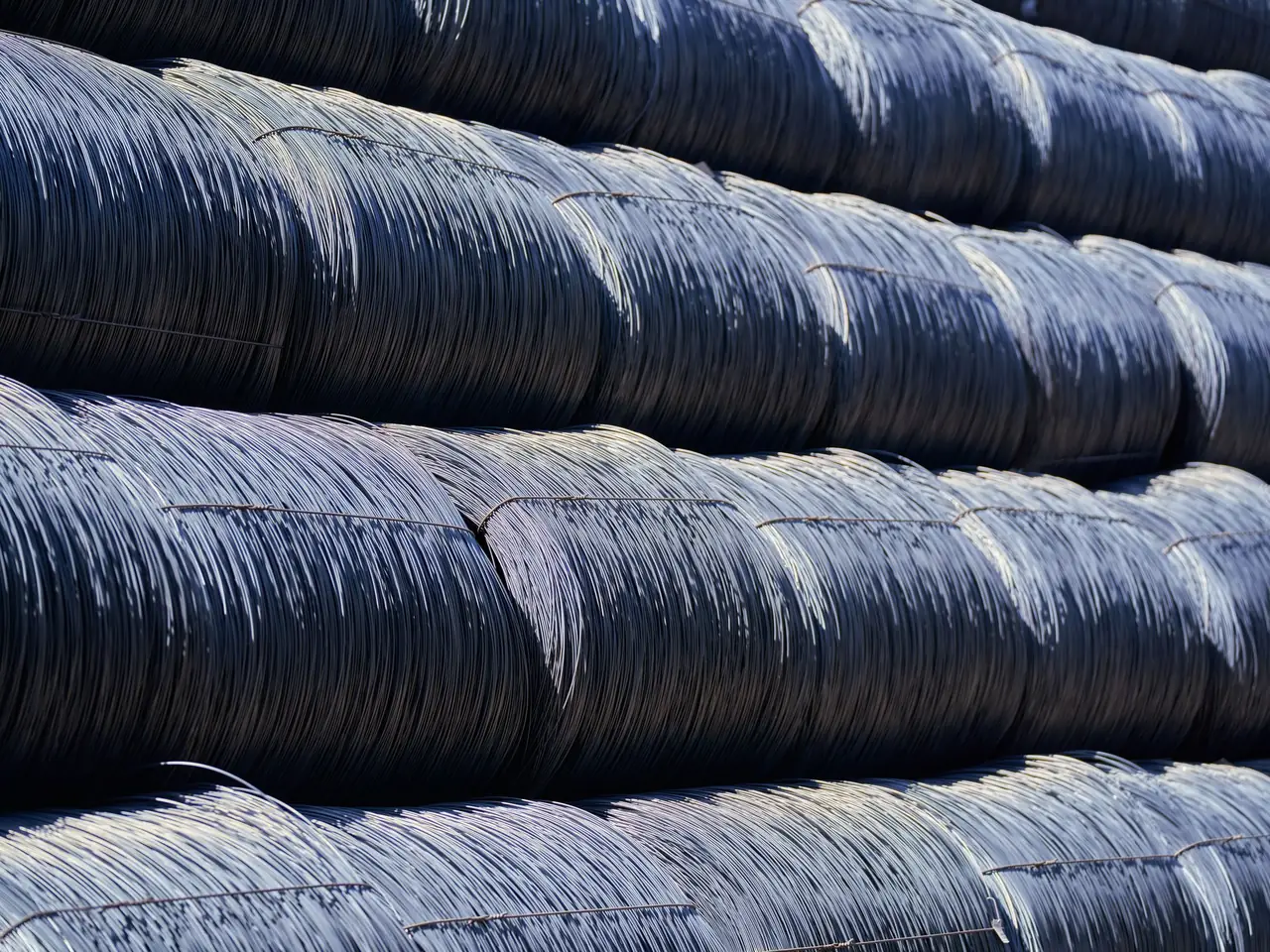 Rows of drawn wire coils stacked in a mill yard