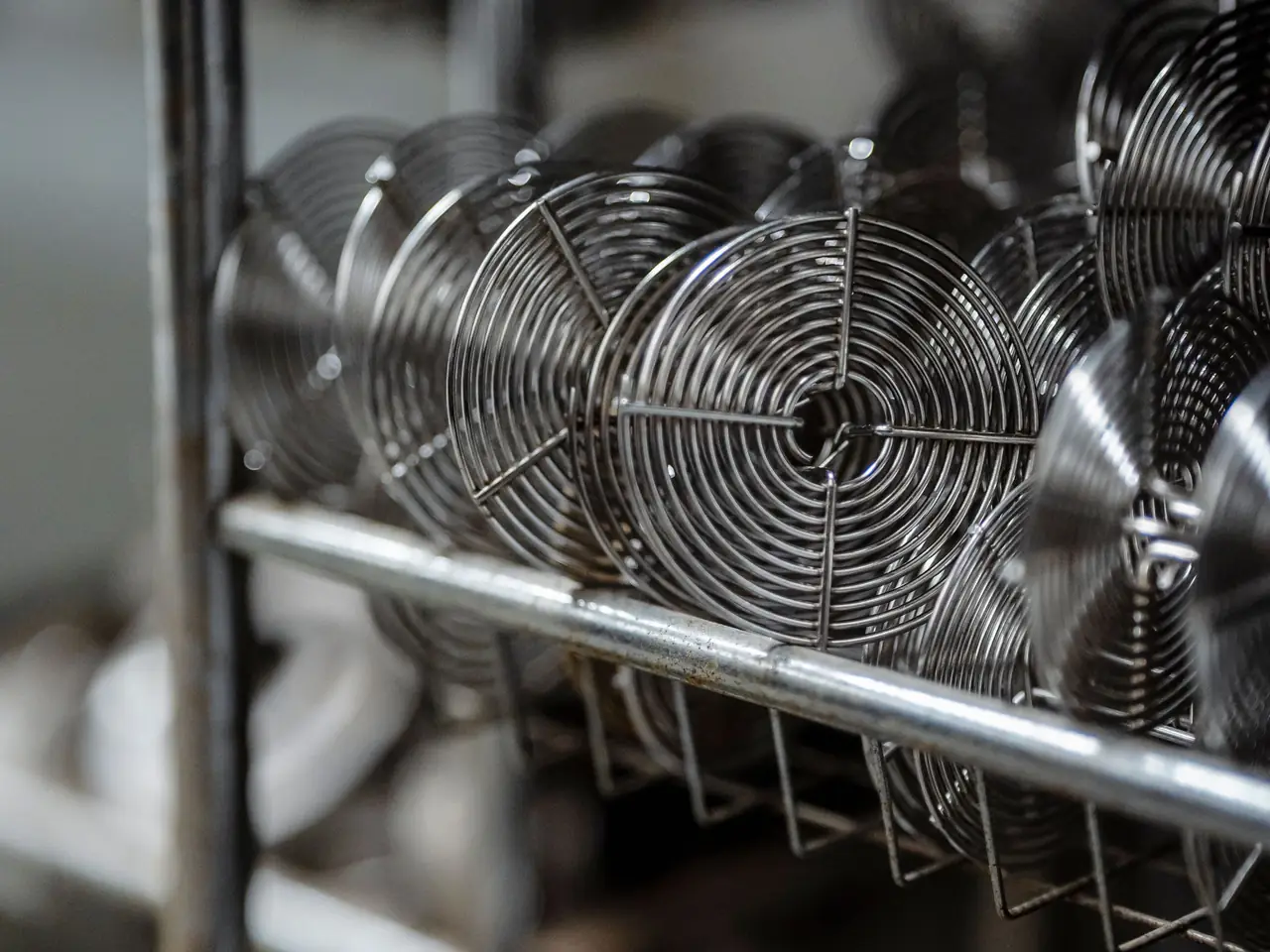 Coiled fine wire on a workshop rack
